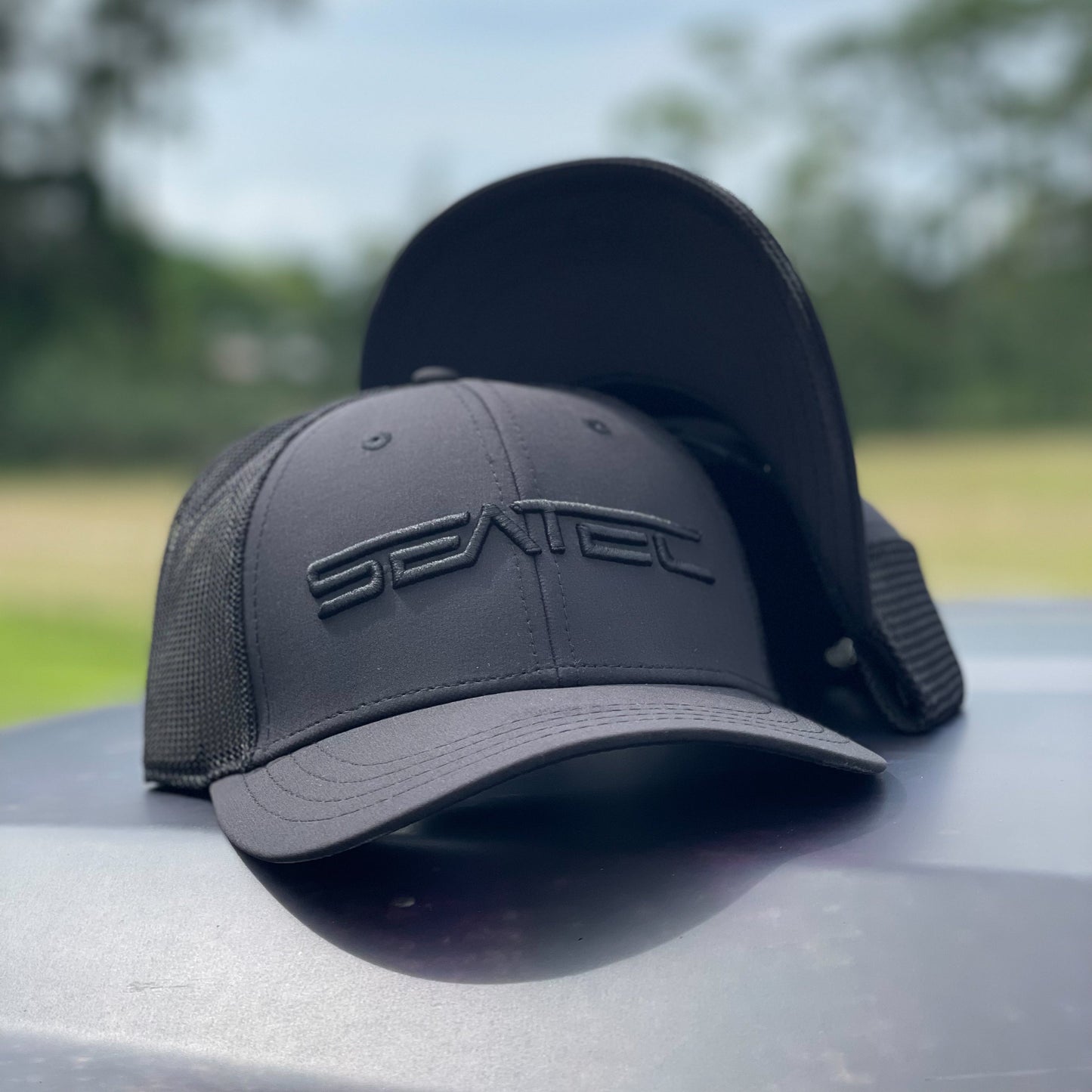 Midnight Tech Mesh performance snapback trucker hat with flex sweatband by Seatec Outfitters